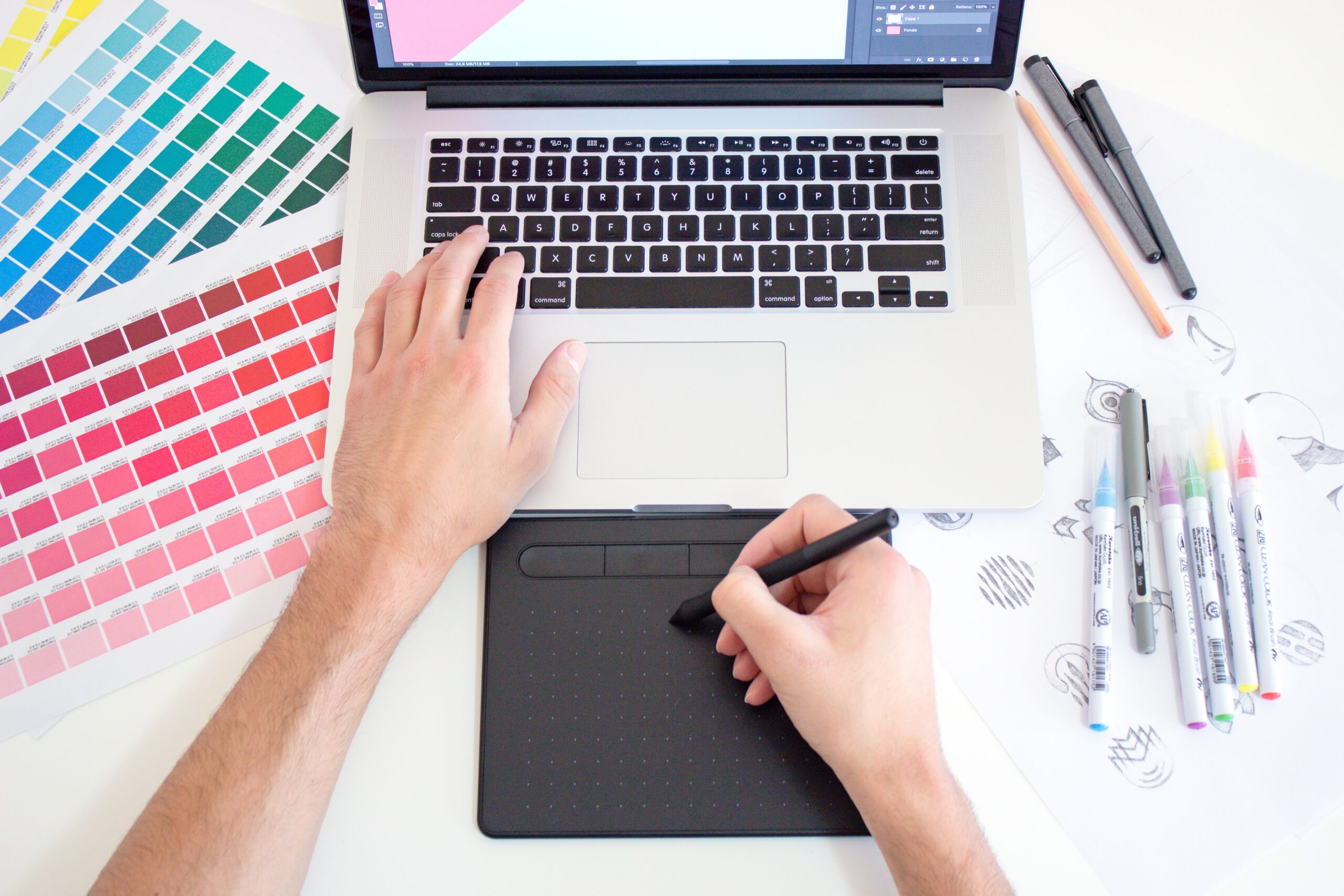 A graphic designer working with Pantone colors.